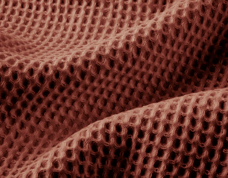 Bio Waffelpikee Stoff aus kbA Baumwolle mit großem Muster in Ziegel Rot von Cotonea